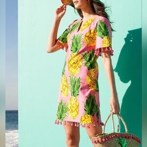 Trina Turk / Pink  shift dress with yellow pineapples and tassels.